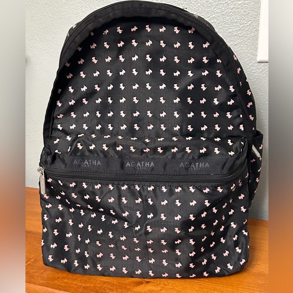 Agatha Paris Black Backpack With Pink Scottie Dog Pattern all over.